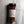 A clear plastic spice jar of Casa Flake Blazing Roots seasoning with a black lid and white label, set against a gray marble background.