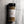 A clear plastic spice jar of Casa Flake Bristol Bay Seasoning with a black lid and white label, set against a gray marble background.