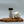 Casa Flake California Onion Powder jar with a white onion on a wooden cutting board against a light gray background