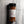 A clear plastic spice jar of Casa Flake Cajun Seasoning with a black lid and white label, set against a gray marble background.