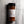 A clear plastic spice jar of Casa Flake Espresso Rub with a black lid and white label, set against a gray marble background.