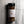 A clear plastic spice jar of Casa Flake Fuego Dulce Blend with a black lid and white label, set against a gray marble background.
