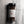 A clear plastic spice jar of Casa Flake Gourmet Peppercorn Mix with a black lid and white label, set against a gray marble background.