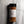 A clear plastic spice jar of Casa Flake Honey Aleppo Pepper Seasoning with a black lid and white label, set against a gray marble background.