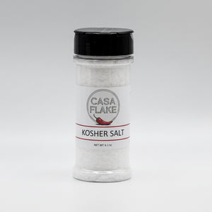 Bottle of Casa Flake Kosher Salt on a gray background
