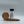 Kosher salt container with wooden lid on a white background