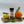 Casa Flake Lemon Orange Herb seasoning bottle on a wooden board with lemon, orange, and herbs.