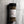 A clear plastic spice jar of Casa Flake Rustic Reserve seasoning with a black lid and white label, set against a gray marble background.