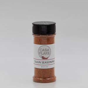 Bottle of Casa Flake Cajun Seasoning on a gray background