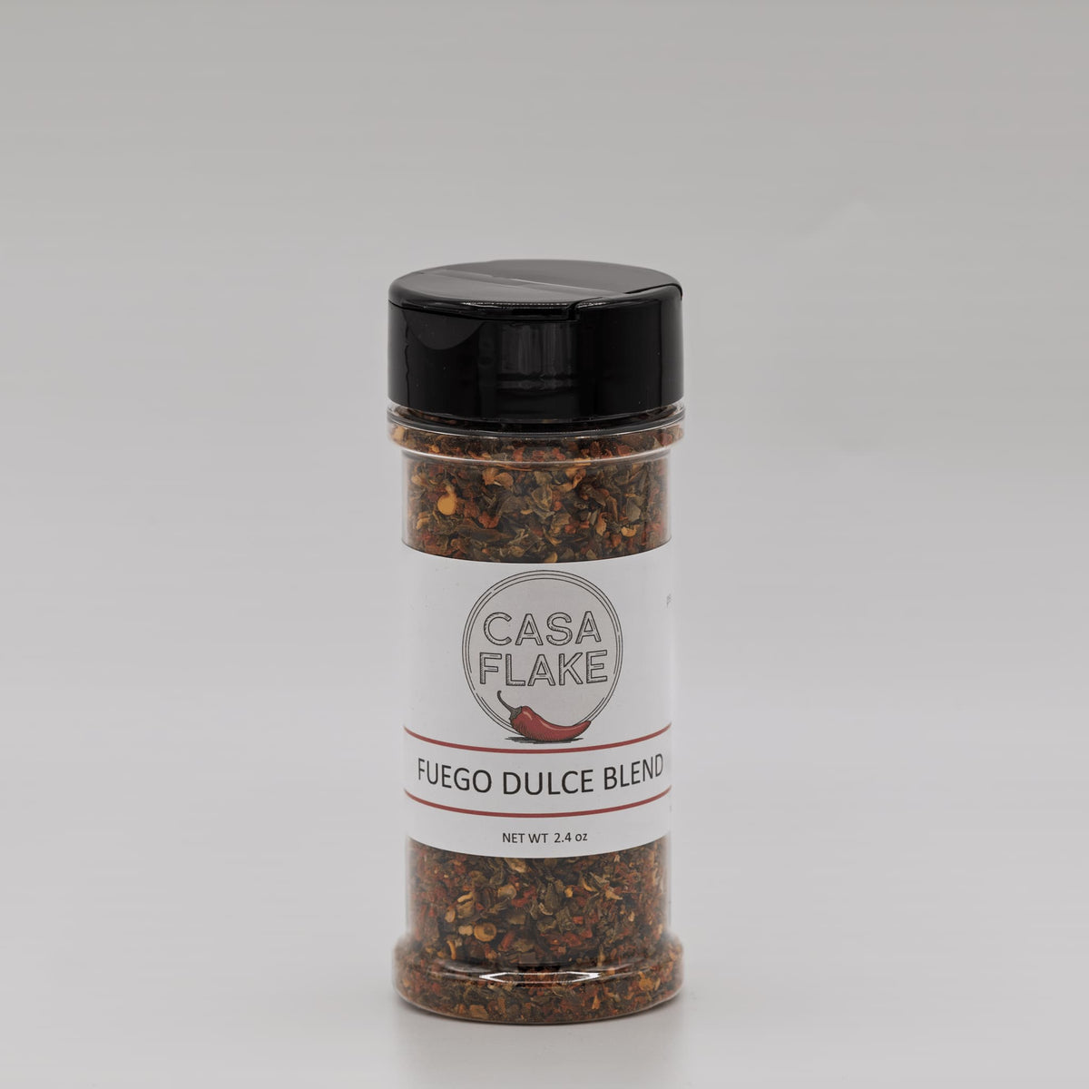 Spice jar labeled 'Casa Flake Fuego Dulce Blend' on a gray background