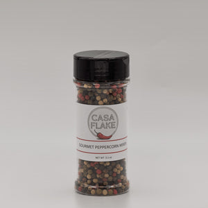 Jar of Casa Flake Gourmet Peppercorn Blend on a gray background