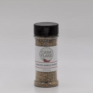 Bottle of Casa Flake Roasted Garlic Pepper on a gray background