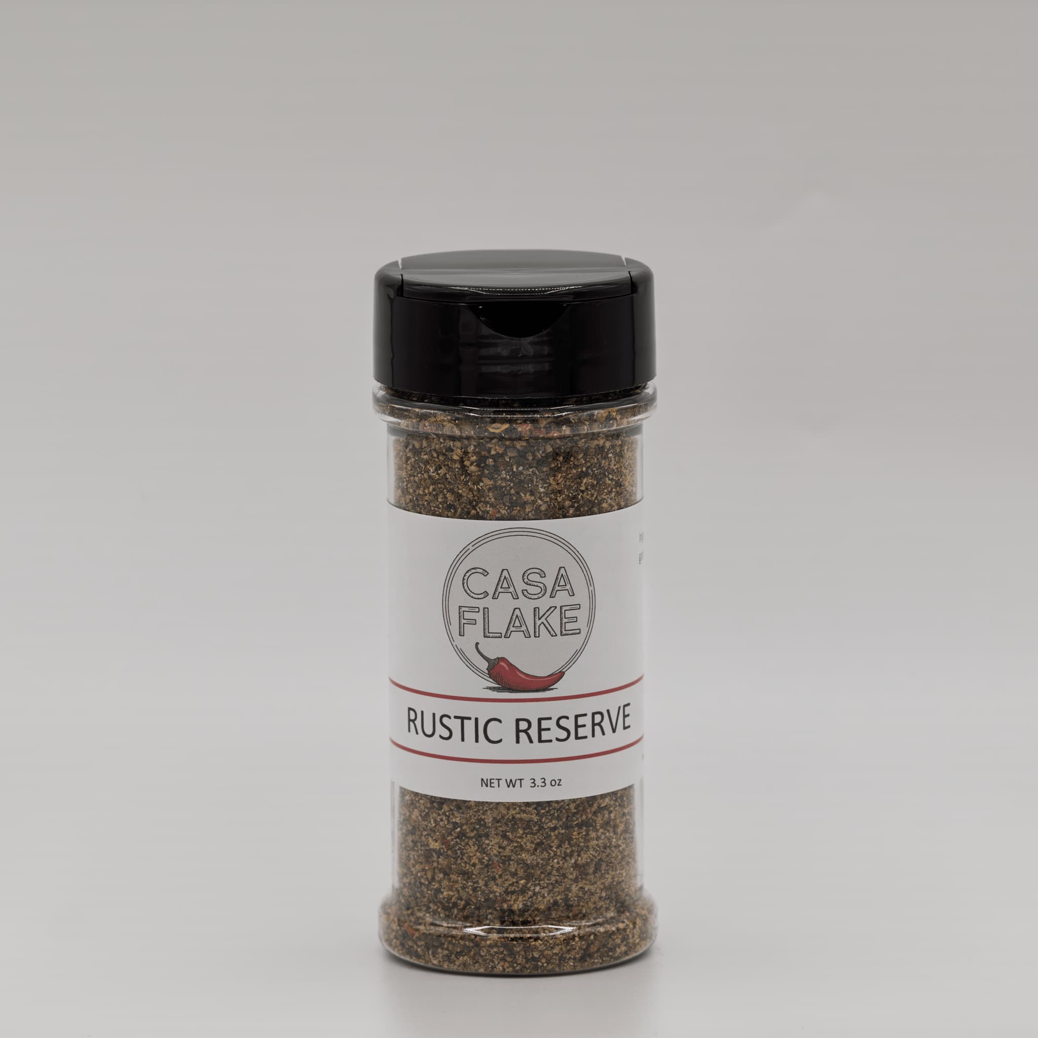 Spice jar labeled 'Casa Flake Rustic Reserve' on a gray background