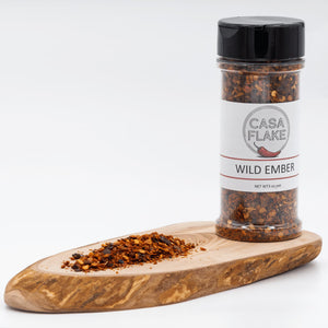 Casa Flake Wild Ember spice jar on a wooden board with a white background